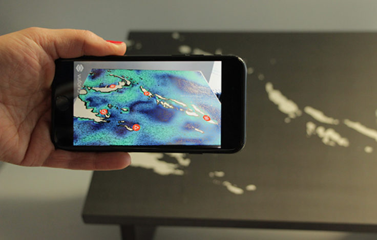 Layering of real-time climate data onto a printed map via augmented reality. © SPK / S. Faulstich